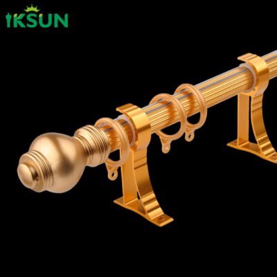 Gold aluminum single curtain rod with finial and rings close up.