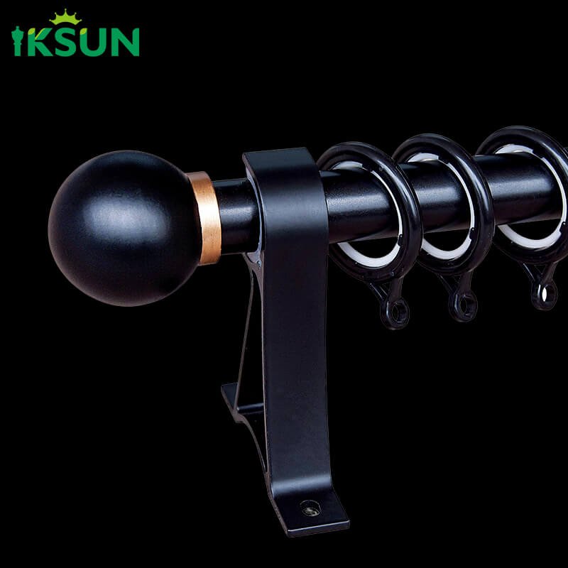 Black aluminum single curtain rod on a black background, stylish appearance with spherical finial design.
