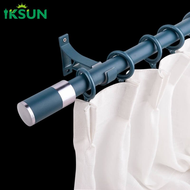 Blue aluminum single curtain rod displaying curtains hanging on a black background.