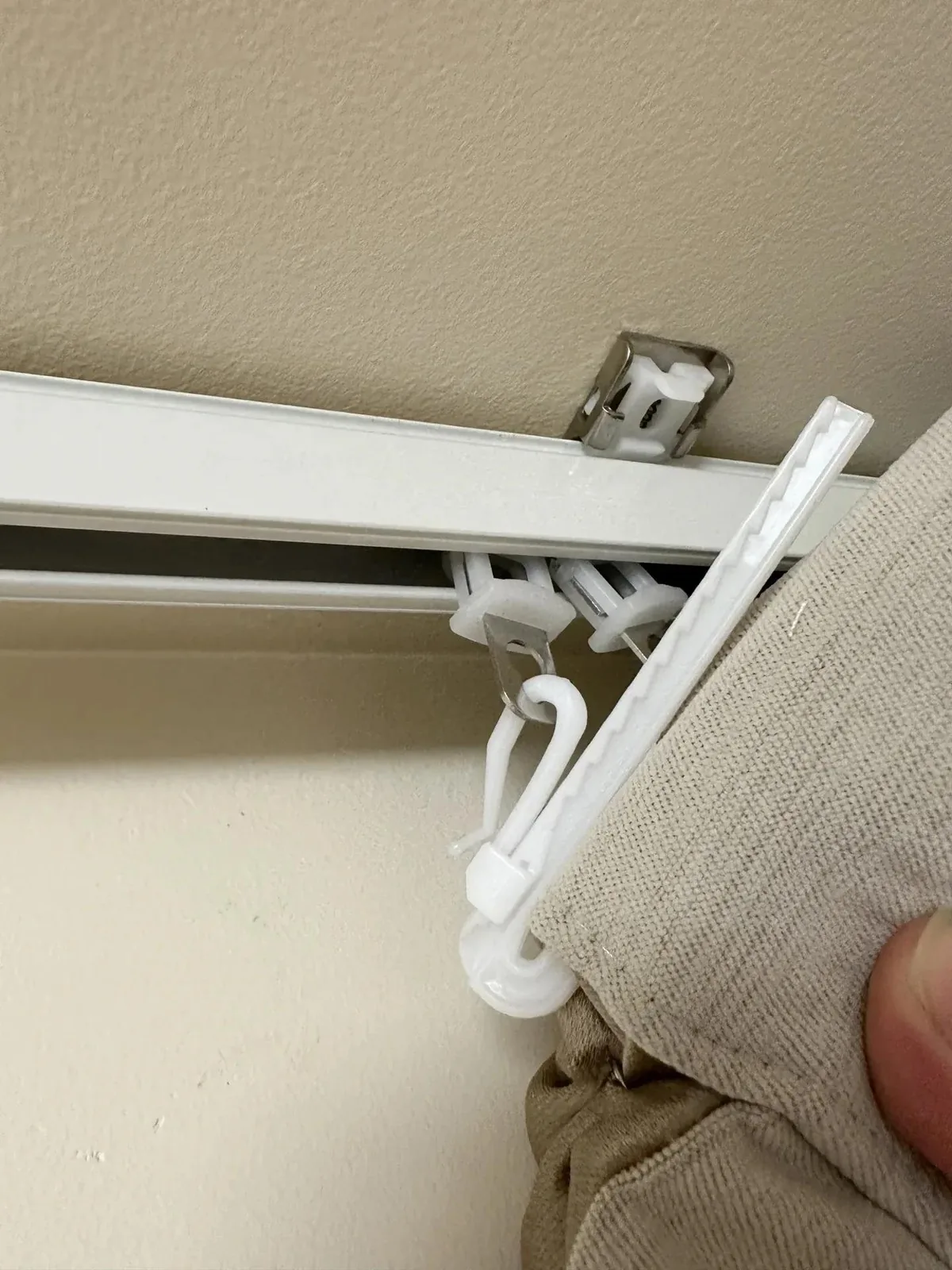IKSUN adjustable curtain hook fitted through carrier on ceiling curtain track